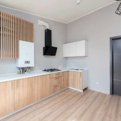 Stylish modern kitchen with wooden cabinets and a sleek design.